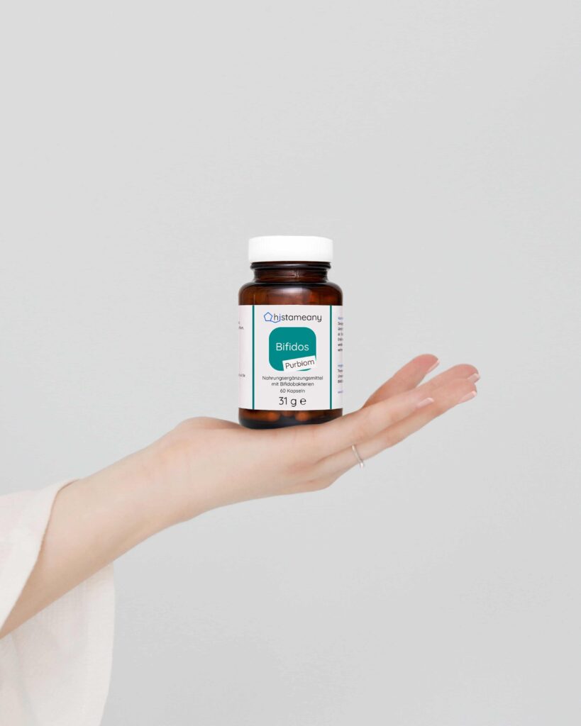 visual content creation of supplement brand featuring hand holding pill bottle