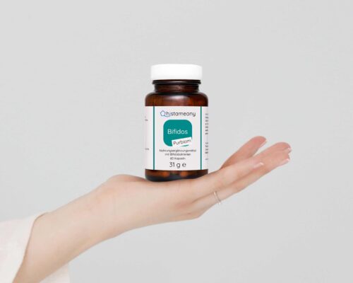 visual content creation of supplement brand featuring hand holding pill bottle